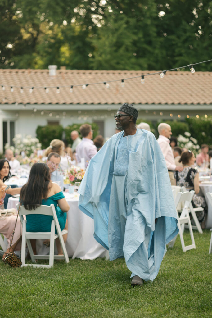 wedding guests walks to microphone for speech
