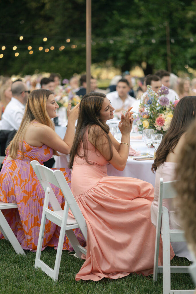 wedding guests clap after speech