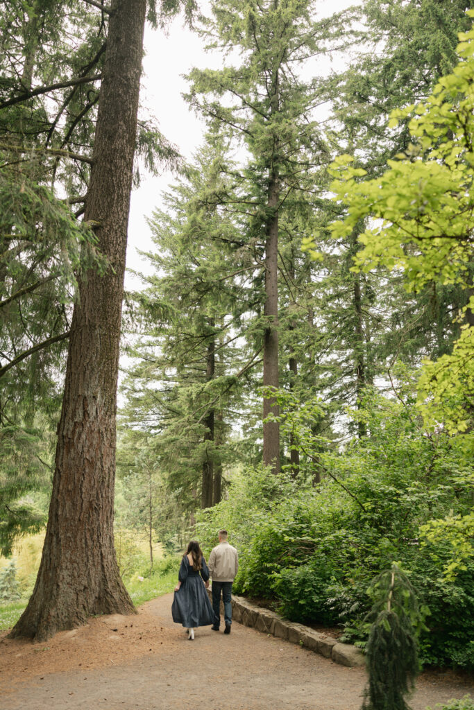 couple walking on trail at hoyt arboretum portland