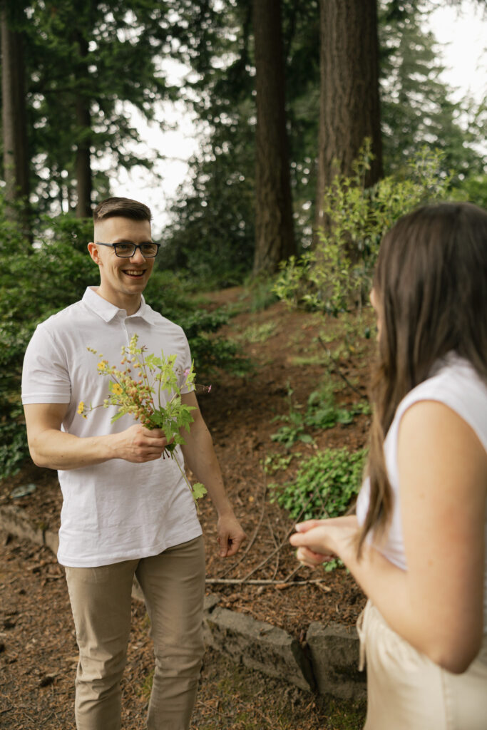 man brings bouquet to woman