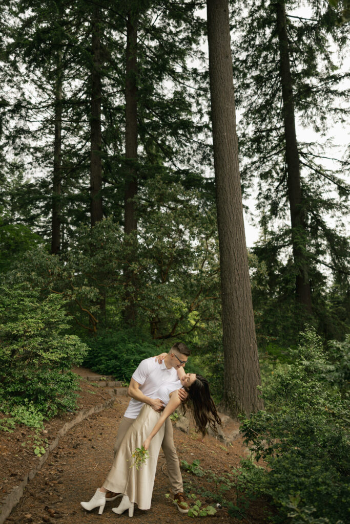man dips woman at hoyt arboretum portland