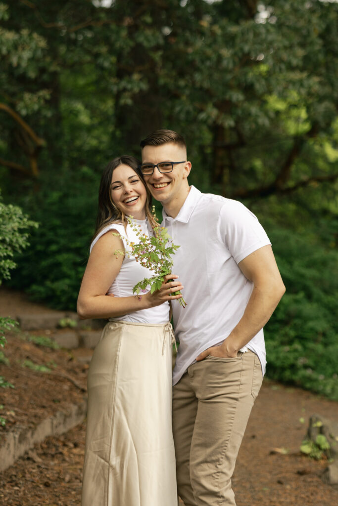 couple laughs at camera