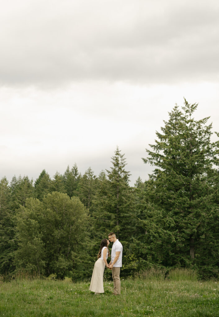 couple kisses in open field