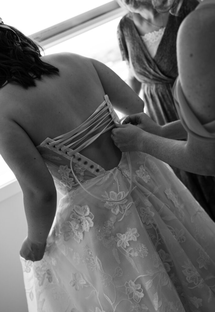 bride getting into dress