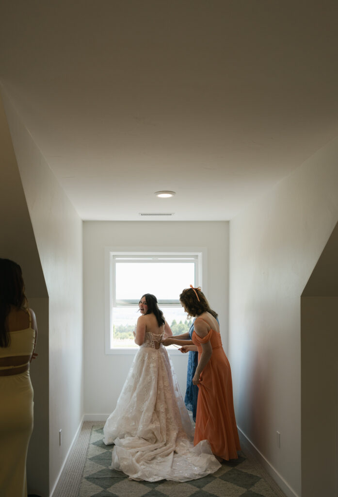 bride getting into dress