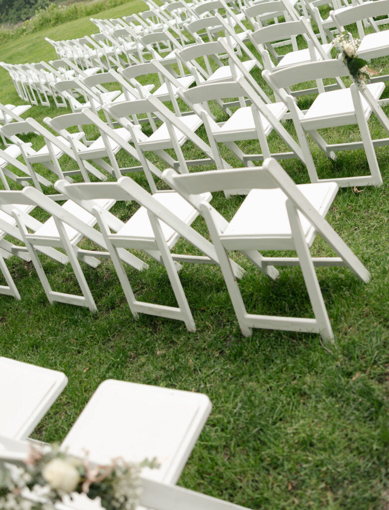 ceremony chairs in grass