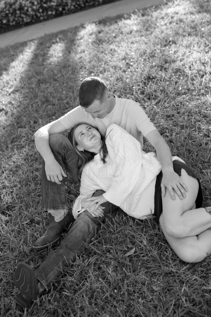 Couple laying down in park in st petersburg fl