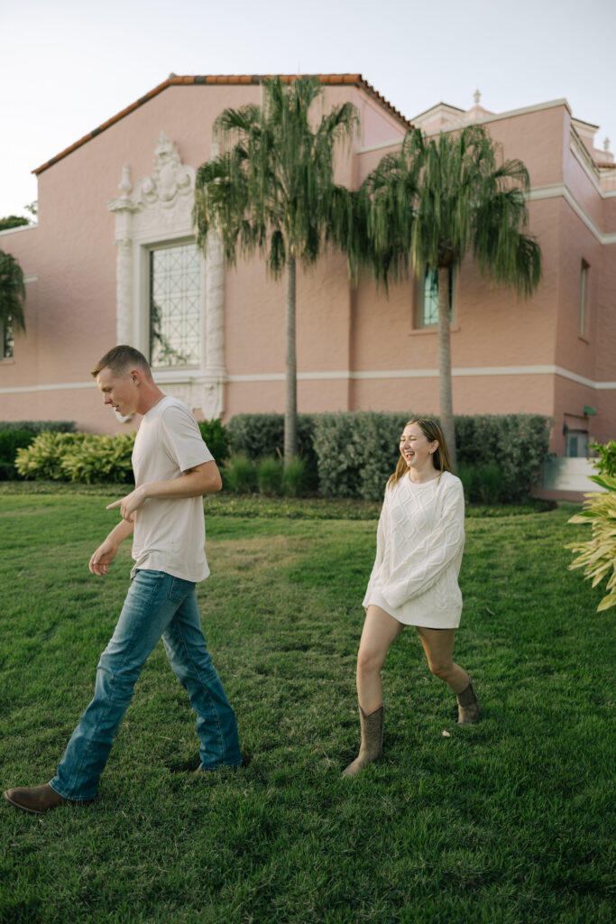 couple walking in front of vinoy st petersburg