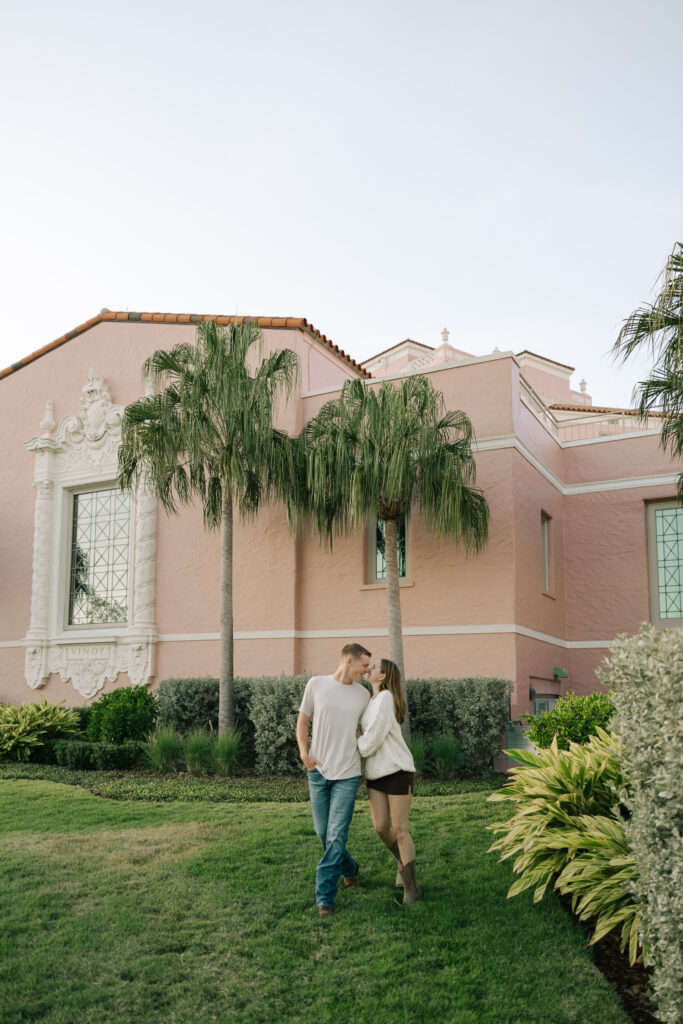 couple walking in front of vinoy st petersburg