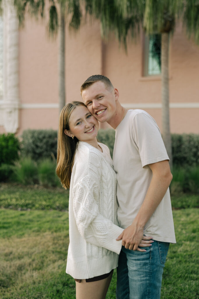 couple smiling in front of vinoy in st petersburg