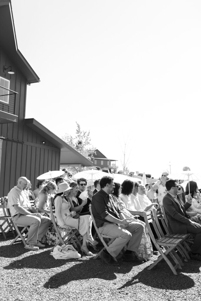 wedding guest sitting waiting for ceremony to begin