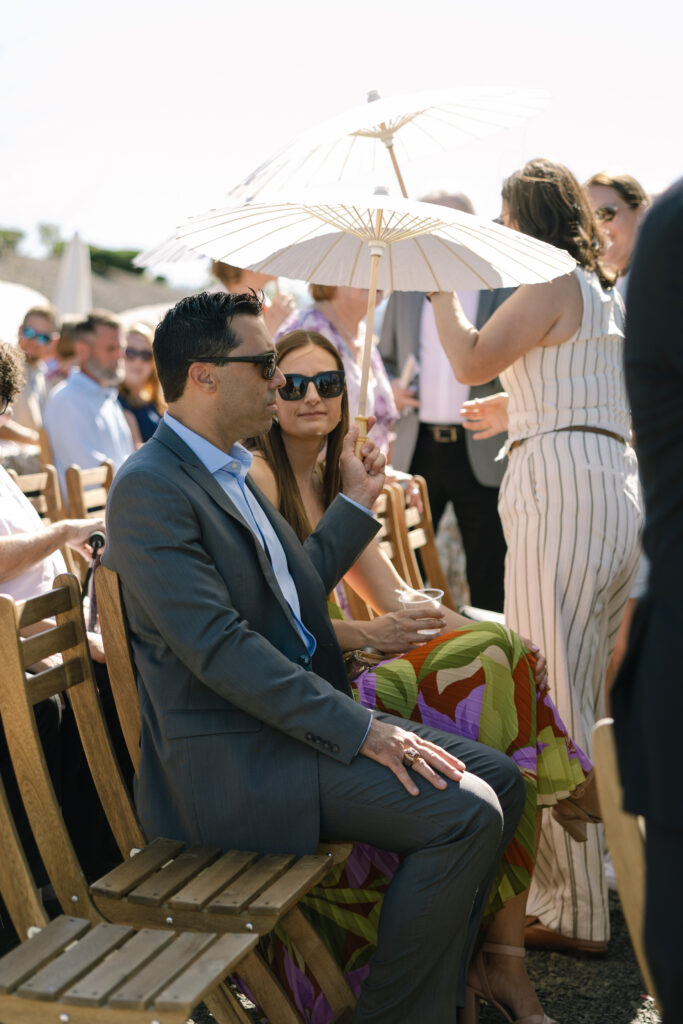 wedding guests sitting waiting for ceremony to begin
