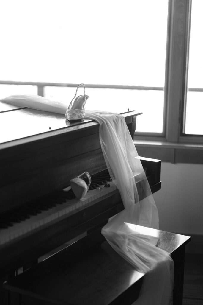 shoes and veil handing off of piano