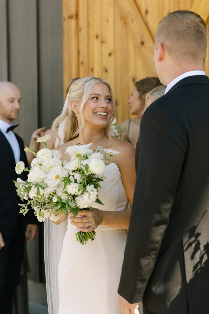 bride smiling at something groom said