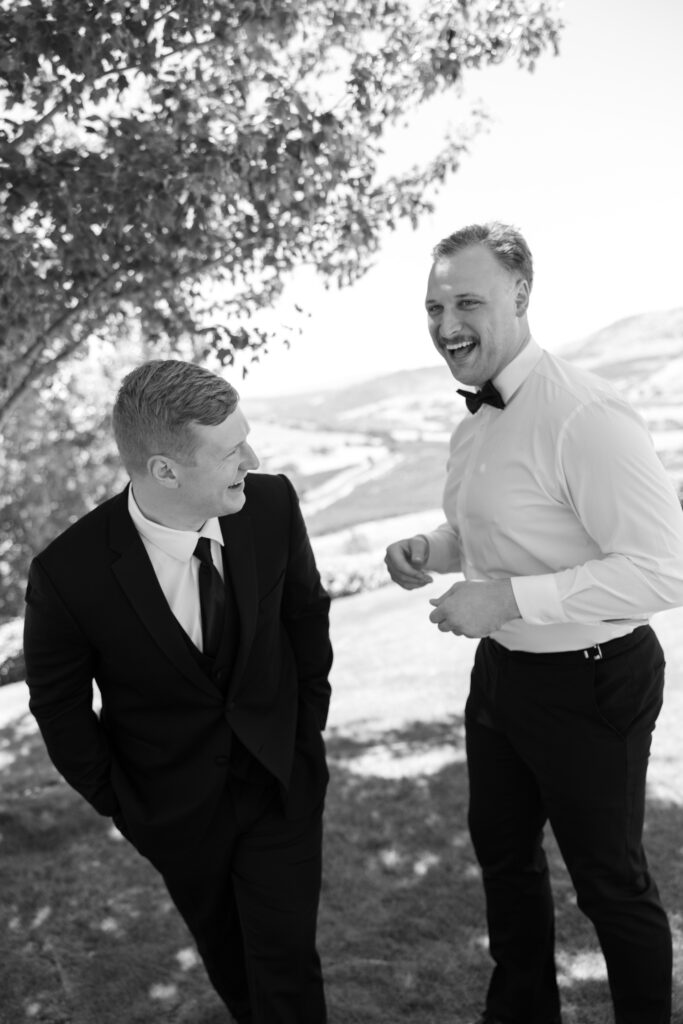 groom laughing with best man