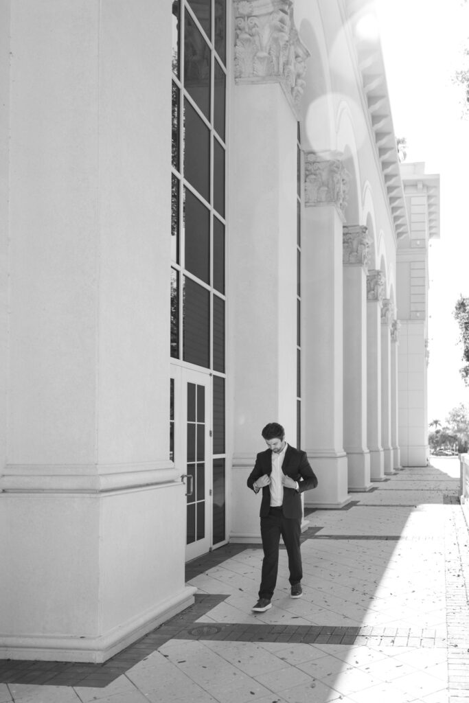 groom walking on balcony