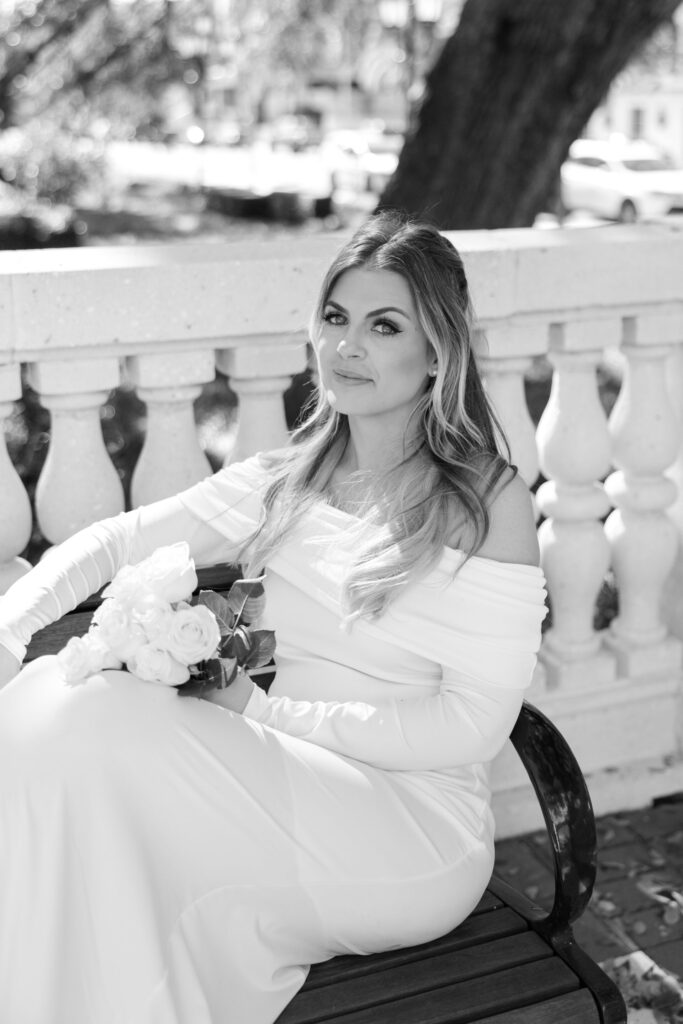 bride sitting on bench after clearwater courthouse wedding