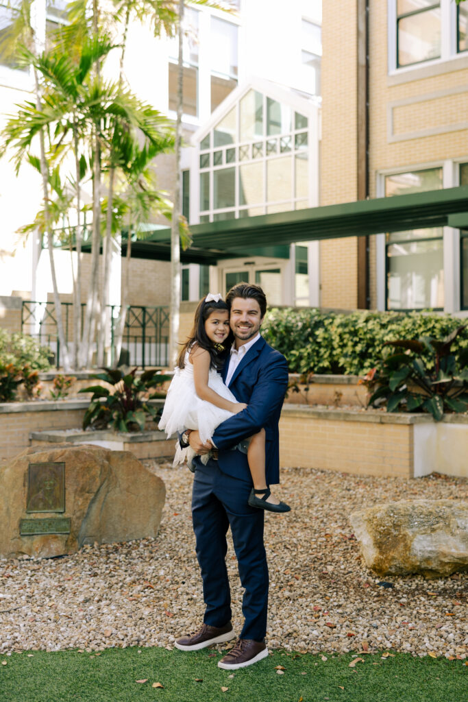 groom smiling with daughter